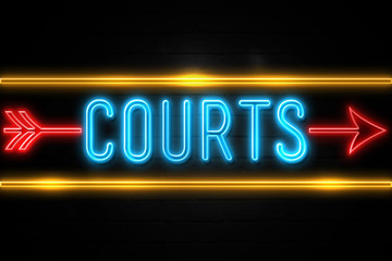 Courts  - fluorescent Neon Sign on brickwall Front view