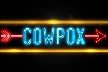Cowpox  - fluorescent Neon Sign on brickwall Front view