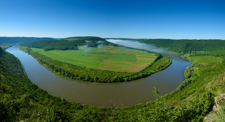 Fototapeta na wymiar Dnister river landscape in Ternopil region of western Ukraine. Idillyc view from above in the morning. Panorama