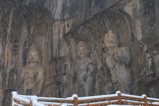 Longmen Grottoes (Longmen Caves) At Luoyang, China Under Heavy Snow. The Longmen Grottoes Are One Of The Finest Examples Of Chinese Buddhist Art.