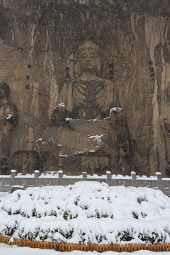 Longmen Grottoes (Longmen Caves) At Luoyang, China Under Heavy Snow. The Longmen Grottoes Are One Of The Finest Examples Of Chinese Buddhist Art.