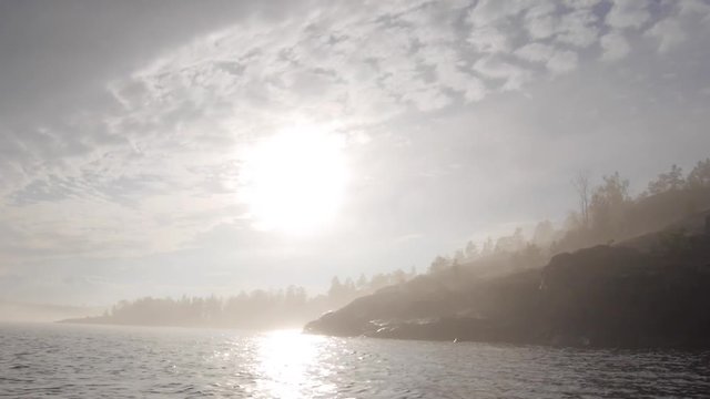 sun and fog oo Ladoga lake.on boat. Karelia, Russia.