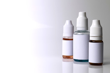 Isolated e liquid bottles for vape devices on a white background