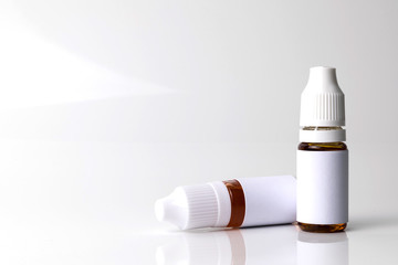 Isolated e liquid bottles for vape devices on a white background