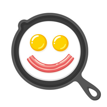 Smiling fried eggs and bacon in skillet