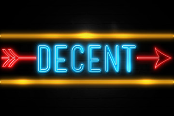 Decent  - fluorescent Neon Sign on brickwall Front view