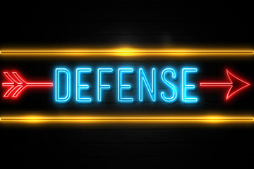 Defense  - fluorescent Neon Sign on brickwall Front view