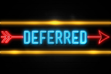 Deferred  - fluorescent Neon Sign on brickwall Front view
