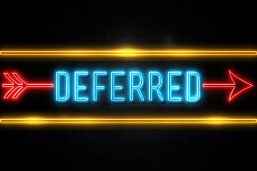 Obraz premium Deferred - fluorescent Neon Sign on brickwall Front view