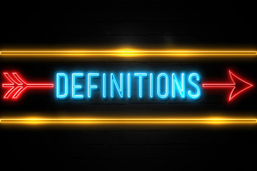 Definitions  - fluorescent Neon Sign on brickwall Front view