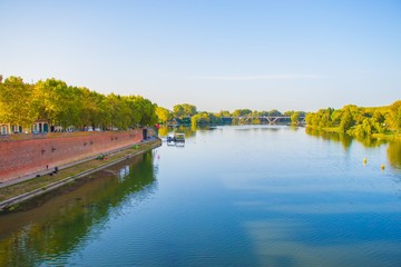Fototapeta premium The embankment of the river in the city in the early morning.