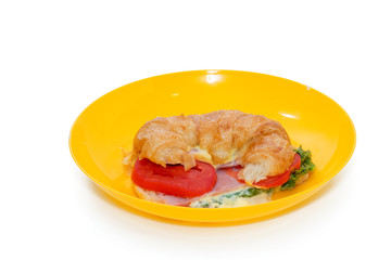 croissant ham and cheese on plate