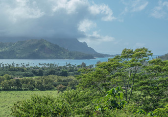 Fototapeta premium Hanalei bay on a cloudy day, with mountains and lush green landscape, on Kauai
