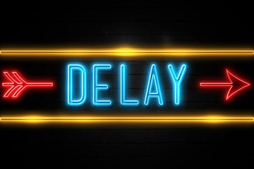 Delay  - fluorescent Neon Sign on brickwall Front view