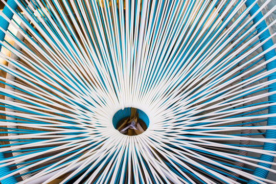A pattern obtained from beach chairs setings one on top of another. 