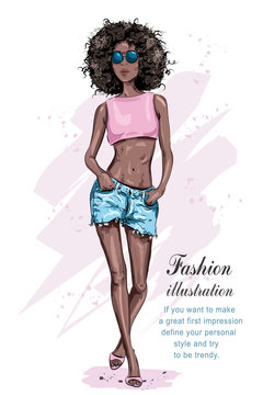 Beautiful young African American woman with an afro hairstyle. Fashion woman. Hand drawn black skin girl. Sketch. Vector illustration.