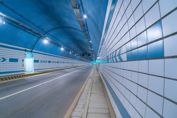 Car driving on to tunnel.