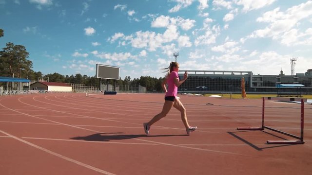 Professional female hurdler during training