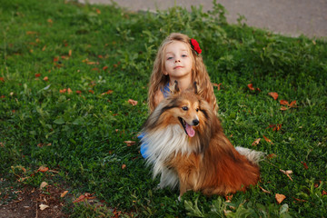 Little girl with a dog Sheltie