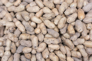 Peanuts in shell texture background. Raw peanuts on display