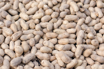 Peanuts in shell texture background. Raw peanuts on display
