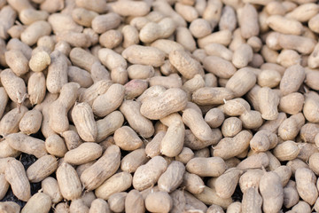 Peanuts in shell texture background. Raw peanuts on display