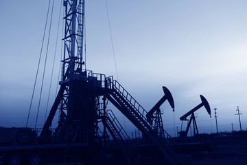 The pumping unit is working in the setting sun