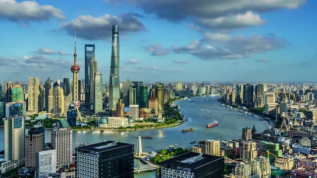 4K panning shot timelapse: Aerial view of high-rise buildings with Huangpu River in Shanghai, China.