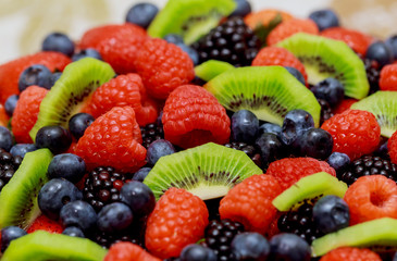 velvet cake with beautiful berries strawberries, raspberries, blueberries