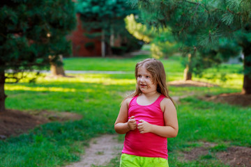 Beautiful little girl on the street through