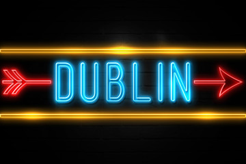 Naklejka na ściany i meble Dublin - fluorescent Neon Sign on brickwall Front view