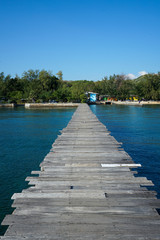 Wooden bridge into the sea. Property is located at the end of the runway into the sea