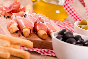 Grissini breadsticks with ham. 
