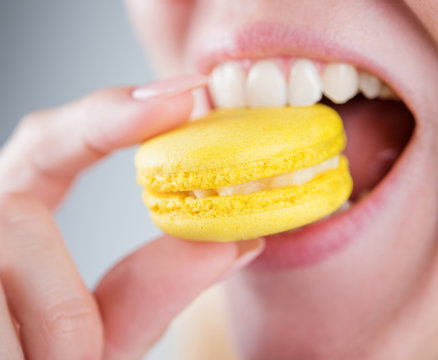 girl bites macarons