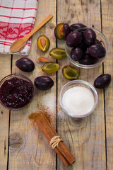 Fototapeta na wymiar Plums and ingredients for preparing plum jam