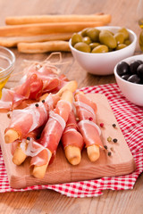 Grissini breadsticks with ham. 