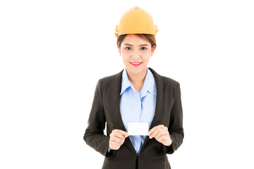Young attractive confident asian woman, orange safety hat, black suit, blue shirt on white background holding white card.