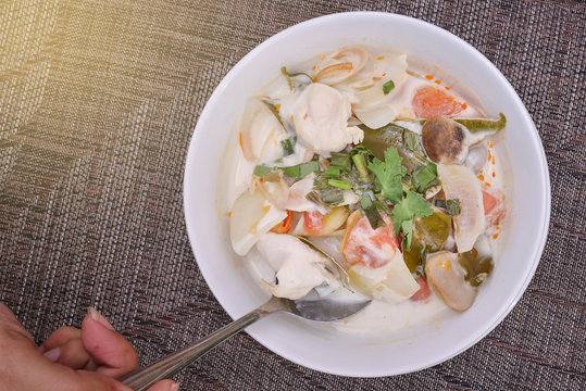 Top View Thai Food : Chicken Soup in Coconut Milk, light effect.