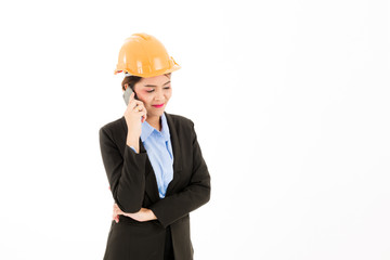Young confident asian woman, orange safety hat, black suit, blue shirt on white using smart  phone device.