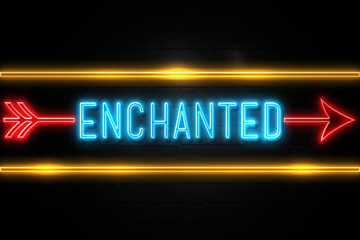 Obraz premium Enchanted - fluorescent Neon Sign on brickwall Front view