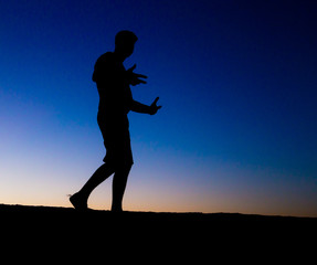 Silhouette of a man at sunset