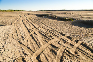 Car track on the sand in the desert