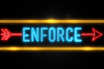 Enforce  - fluorescent Neon Sign on brickwall Front view