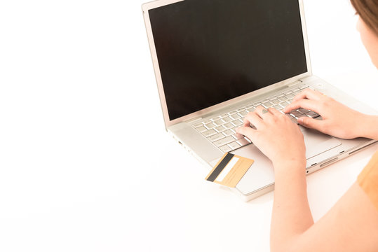 Beautiful Young Teen Asian Orange Shirt Woman Holding Credit Card With Laptop On White Background.