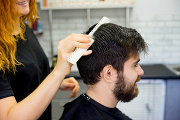 Barber dressing hair