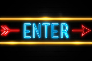 Enter  - fluorescent Neon Sign on brickwall Front view