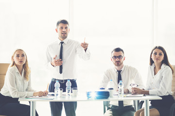 Fototapeta premium The business people discuss a presentation on the sunny background