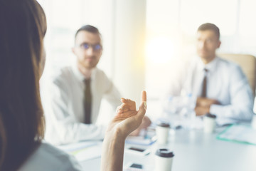 The three business people hold a conference