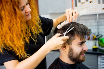 Fototapeta premium Barber with scissors