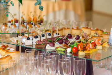 Delicacies and snacks at the Banquet. The buffet celebration. Restaurant catering. Table setting at the reception.